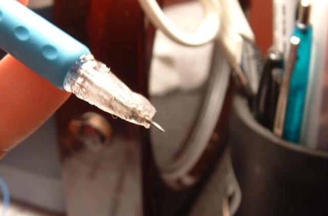 R. Ubartui - "Olimpiniai žiedai" ir Sporto garbės komandoro ženklas